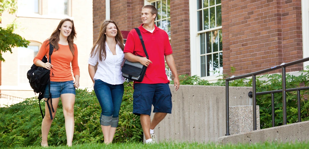Mother walking on campus with her college aged kids