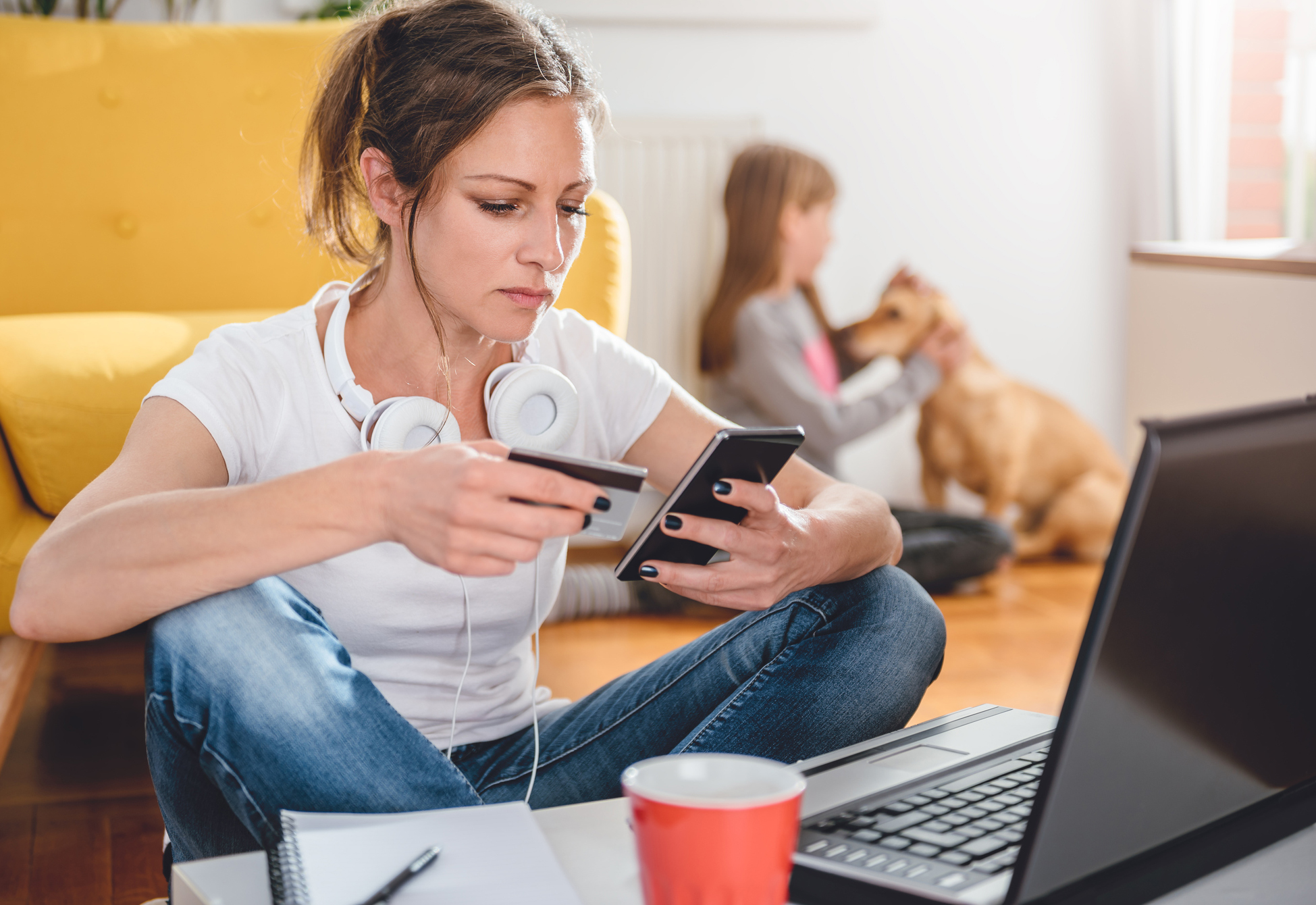 Woman entering her credit card information using a mobile device.